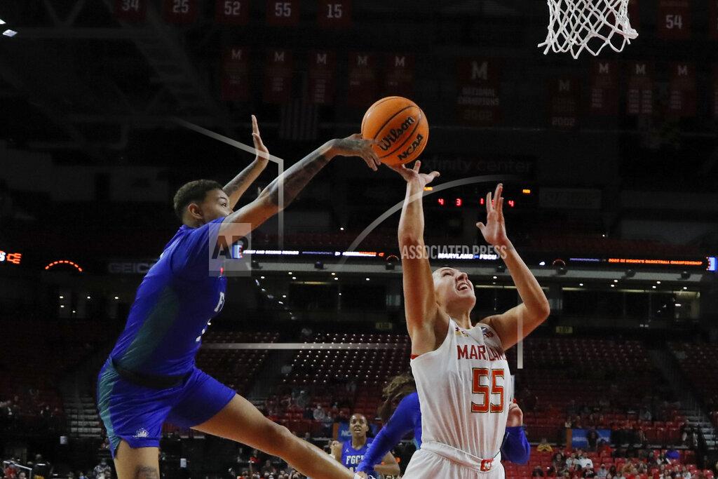 Julio Cortez Florida Gulf Coast guard Kierstan Bell, left, blocks a shot by Maryland forward Chloe Bibby (55) during the first half of a college basketball game in the second round of the NCAA tournament, Sunday, March 20, 2022, in College Park, Md. Maryland won 89-65. (AP Photo/Julio Cortez)