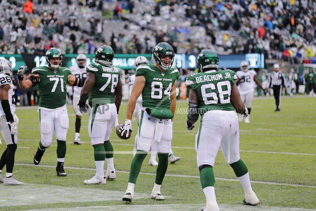 Seth Wenig New York Jets tight end Ryan Griffin (84) celebrates with teammate Kelvin Beachum (68) after scoring a touchdown during the second half of an NFL football game against the Oakland Raiders, Sunday, Nov. 24, 2019, in East Rutherford, N.J. (AP Photo/Seth Wenig)