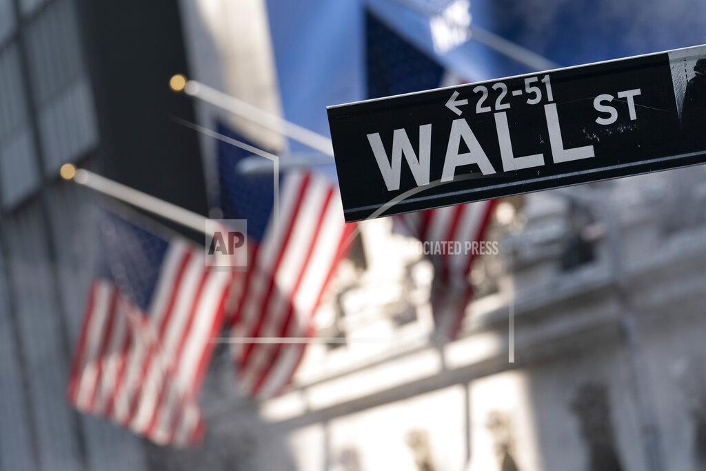 Mark Lennihan A sign for Wall Street hangs in front of the New York Stock Exchange, July 8, 2021. Stocks edged lower in morning trading, quickly reversing course after a brief gain following the latest data on inflation. Communications and industrial companies had some of the broadest losses, while health care stocks gained ground. U.S. consumer prices rose a lower-than-expected 0.3% last month, the smallest increase in seven months and a hopeful sign that inflation pressures may be cooling. (AP Photo/Mark Lennihan, file)