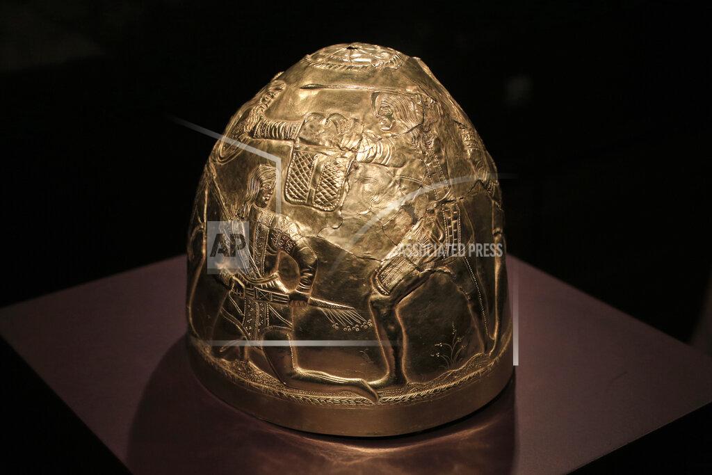 Peter Dejong FILE - In this Friday April 4, 2014 file photo, a Scythian gold helmet from the fourth century B.C. is displayed as part of the exhibit called The Crimea - Gold and Secrets of the Black Sea, at Allard Pierson historical museum in Amsterdam. A Dutch appeals court rules Tuesday Oct. 26, 2021, on ownership of a trove of Crimean historical artifacts that were loaned to an Amsterdam museum shortly before Russia annexed the region. A lower court ruled in 2016 that the treasures should be handed to the Ukrainian government. (AP Photo/Peter Dejong, file)