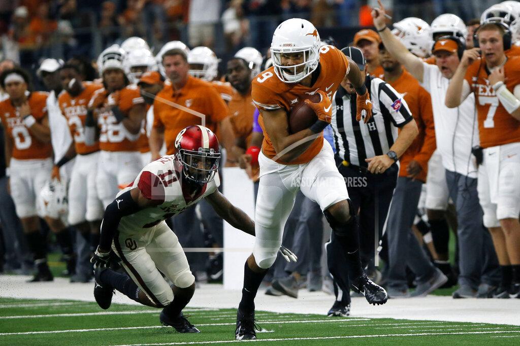 Roger Steinman FILE - In this Dec. 1, 2018, file photo, Texas wide receiver Collin Johnson (9) runs as Oklahoma cornerback Parnell Motley (11) attempts a tackle during the first half of the NCAA Big 12 Conference football championship, in Arlington, Texas. Texas opens the 2019 season against Louisiana Tech of Conference USA on Saturday night, Aug. 31, 2019. (AP Photo/Roger Steinman, File)