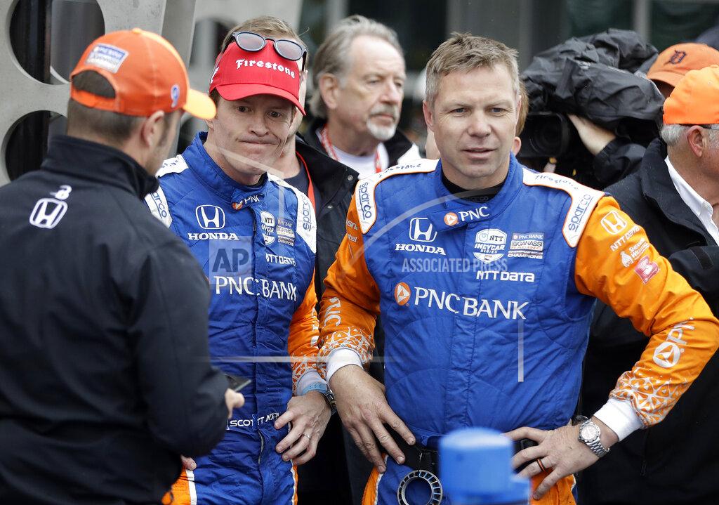 Darron Cummings Scott Dixon, second from left, of New Zealand, reacts after finishing second in the Indy GP IndyCar auto race at Indianapolis Motor Speedway, Saturday, May 11, 2019, in Indianapolis. (AP Photo/Darron Cummings)