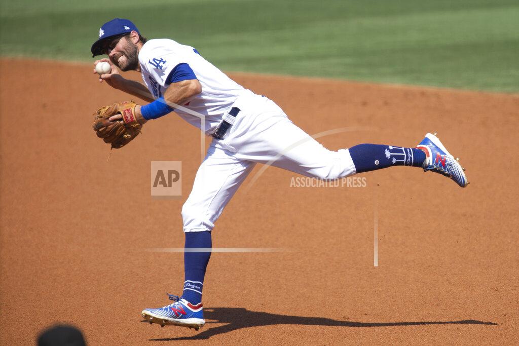 Kyusung Gong Los Angeles Dodgers second baseman Chris Taylor fields a ground ball during the second inning of a baseball game against the Los Angeles Angels in Los Angeles, Sunday, Sept. 27, 2020. (AP Photo/Kyusung Gong)