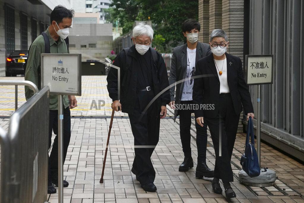 Kin Cheung From left, Hong Kong scholar Hui Po-keung, Catholic Cardinal Joseph Zen, singer Denise Ho and barrister Margaret Ng arrive for an appearance at a court in Hong Kong as they were charged in relation to their past fundraising for activists, Tuesday, May 24, 2022. (AP Photo/Kin Cheung)