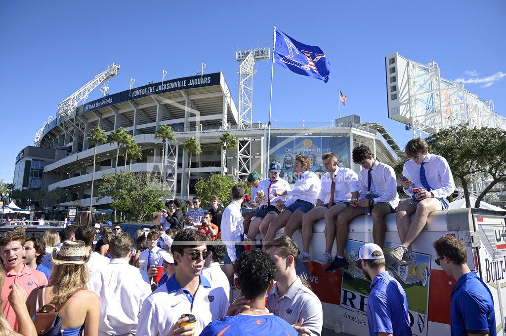 Phelan M. Ebenhack Florida fans gather in the parking lot outside the stadium before an NCAA college football game against Georgia, Saturday, Oct. 30, 2021, in Jacksonville, Fla. (AP Photo/Phelan M. Ebenhack)