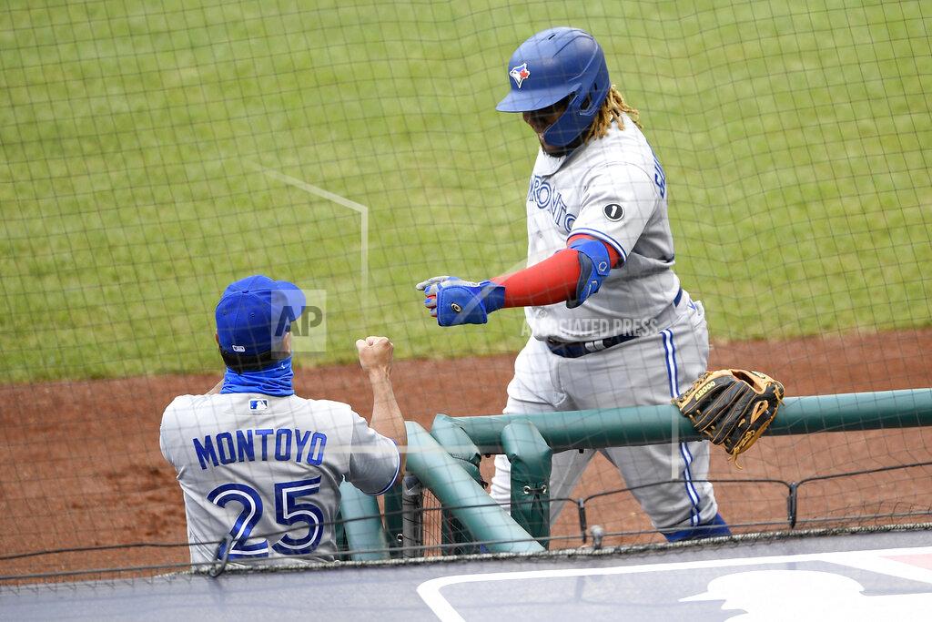 Nick Wass Toronto Blue Jays' Vladimir Guerrero Jr., right, celebrates his home run with manager Charlie Montoyo (25) during the second inning of a baseball game against the Washington Nationals, Tuesday, July 28, 2020, in Washington. (AP Photo/Nick Wass)