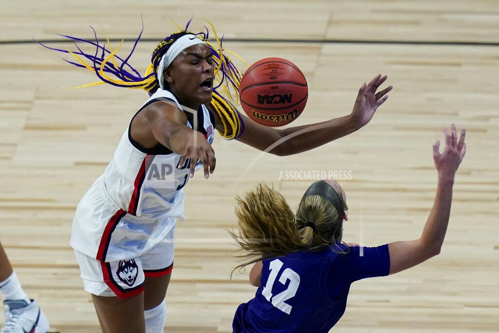 UConn forward Aaliyah Edwards (3) blocks High Point guard Jenson Edwards (12) as she tries to score during the second half of a college basketball game in the first round of the women's NCAA tournament at the Alamodome in San Antonio, Sunday, March 21, 2021. (AP Photo/Eric Gay)