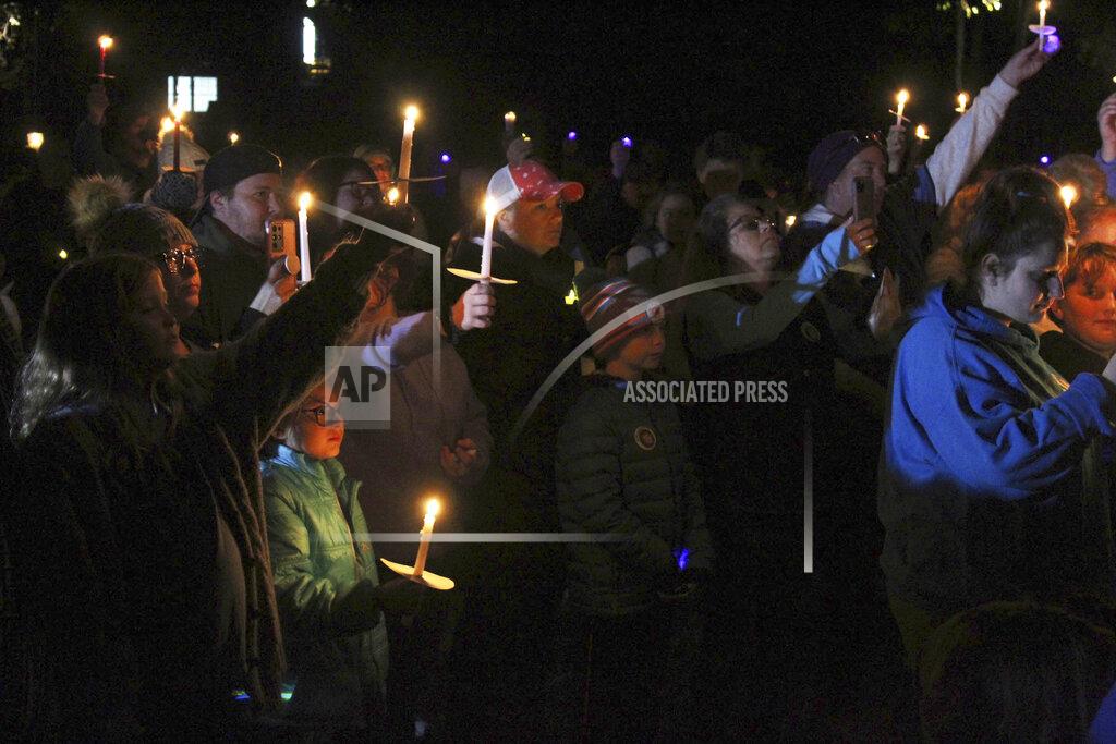 Dean Shalhoup People attend a candlelight vigil in remembrance of 5-year-old Elijah Lewis at Watson Park in Merrimack, N.H, Sunday, Oct. 24, 2021. Hundreds of people gathered for the candlelight vigil for the young boy from New Hampshire who went missing a month ago and was recently found dead. (Dean Shalhoup/The Telegraph via AP)