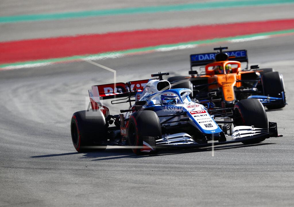Joan Monfort Mclaren driver Lando Norris of Britain, right, and Williams driver Nicholas Latifi of Canada steer their cars through a corner during the Formula One pre-season testing session at the Barcelona Catalunya racetrack in Montmelo, outside Barcelona, Spain, Thursday, Feb. 27, 2020. (AP Photo/Joan Monfort)