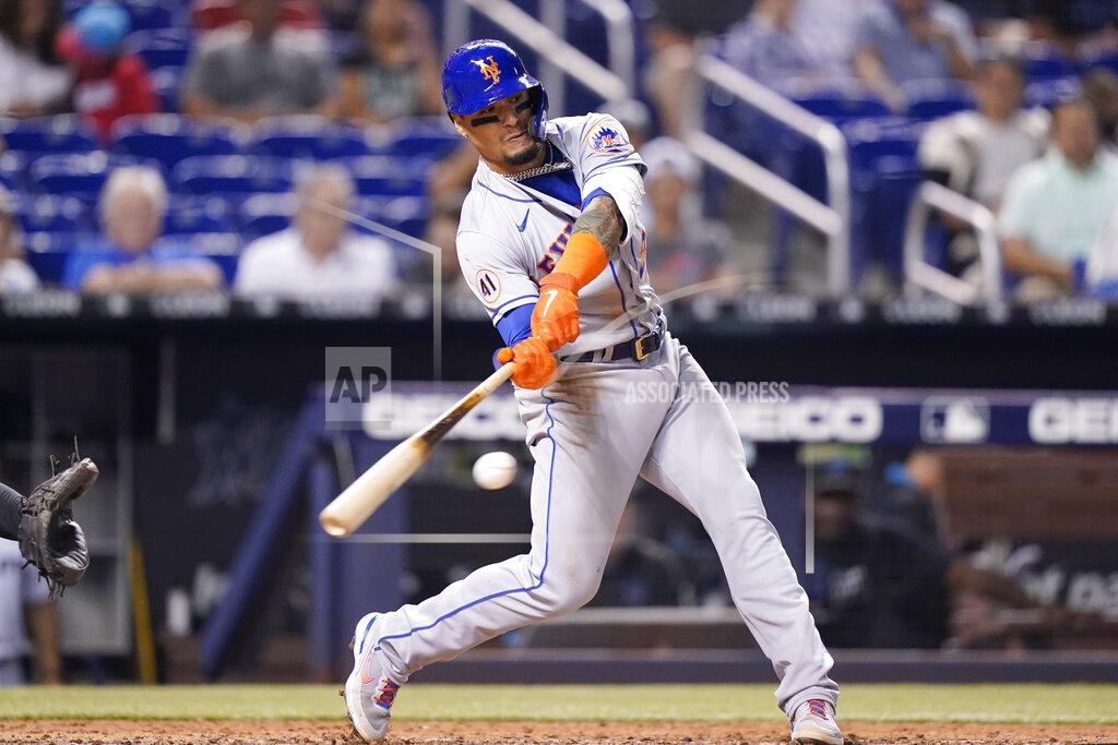 Lynne Sladky New York Mets' Javier Baez hits solo home run during the eighth inning of a baseball game against the Miami Marlins, Wednesday, Aug. 4, 2021, in Miami. The Mets won 5-3. (AP Photo/Lynne Sladky)