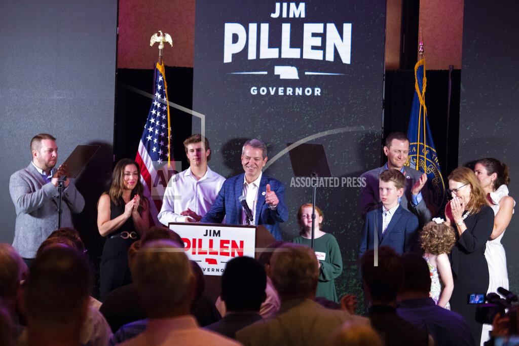 Kenneth Ferriera University of Nebraska Regent Jim Pillen, center, gives a thumbs up to a wave of applause as he is named the winner of the Nebraska Republican gubernatorial primary during an election night party at the Embassy Suites on Tuesday, May 10, 2022, in Lincoln, Neb. (Kenneth Ferriera/Lincoln Journal Star via AP)