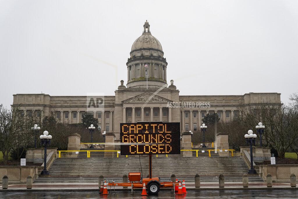 Bryan Woolston A sign displayed outside the Capitol building in Frankfort, Ky., advises that the grounds are closed, Sunday, Jan. 17, 2021. Some state capitols are closed, fences are up and extra police are in place at statehouses across the U.S. as authorities brace for potentially violent demonstrations over the coming days. (AP Photo/Bryan Woolston)