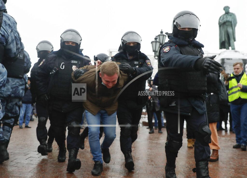 Pavel Golovkin Police detain a man during a protest against the jailing of opposition leader Alexei Navalny in Moscow, Russia, Saturday, Jan. 23, 2021. Russian police are arresting protesters demanding the release of top Russian opposition leader Alexei Navalny at demonstrations in the country’s east and larger unsanctioned rallies are expected later Saturday in Moscow and other major cities. (AP Photo/Pavel Golovkin)