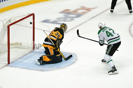 CORRECTS GOALIE TO PITTSBURGH PENGUINS' TRISTAN JARRY, INSTEAD OF STARS' ANTON KHUDOBIN - Dallas Stars' Alexander Radulov (47) scores against Pittsburgh Penguins goalie Tristan Jarry during the shootout in an NHL hockey game, Tuesday, Oct. 19, 2021, in Pittsburgh. Dallas won 2-1. (AP Photo/Keith Srakocic)
