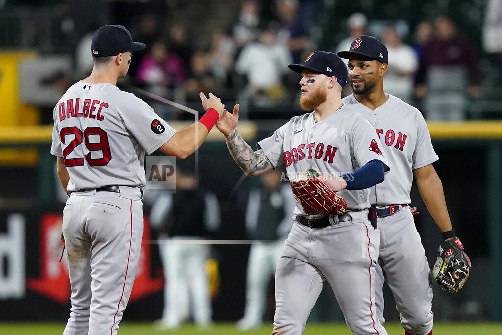 Charles Rex Arbogast Boston Red Sox's Bobby Dalbec, Alex Verdugo and Xander Bogaerts, fromleft, celebrate the team's 16-7 win over the Chicago White Sox in a baseball game Thursday, May 26, 2022, in Chicago. (AP Photo/Charles Rex Arbogast)