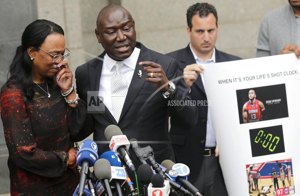 Seth Wenig FILE - In this Wednesday, May 30, 2018 file photo, Jewel Upshaw, the mother of G League basketball player Zeke Upshaw, who died in March after collapsing on a court during a game, becomes emotional as attorney Ben Crump speaks at a news conference in front of the U.S. District Court in New York. Jewel Upshaw filed a lawsuit Wednesday accusing the NBA and the Detroit Pistons of negligence. (AP Photo/Seth Wenig)