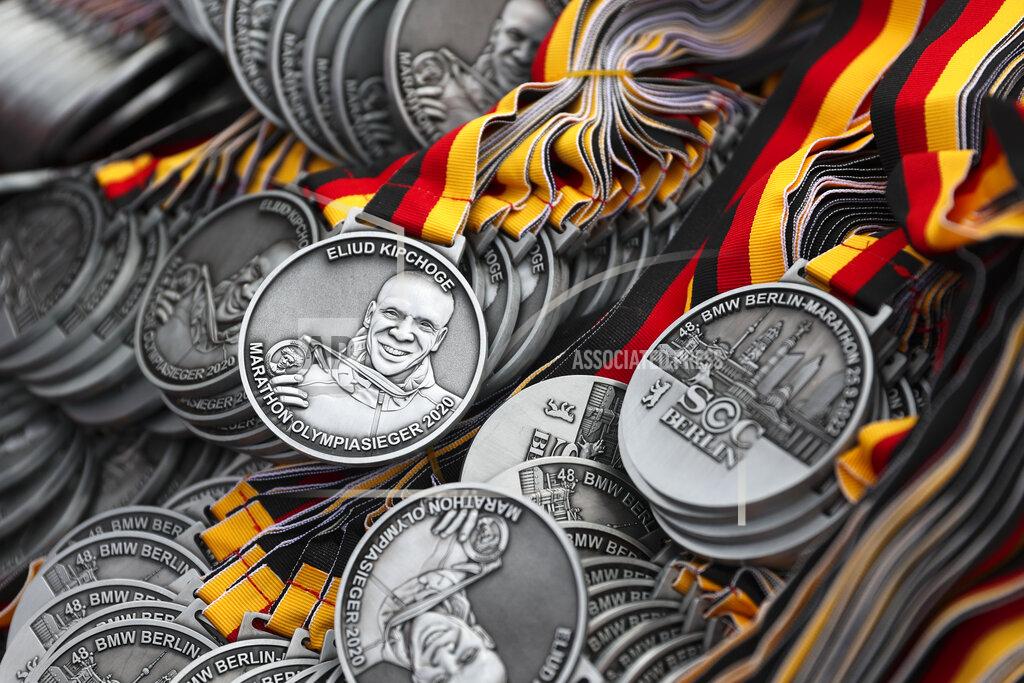 Christoph Soeder A portrait of Eliud Kipchoge is depicted on the participant medals of the Berlin Marathon which are stored in the finish area during the Berlin Marathon in Berlin, Germany, Sunday, Sept. 25, 2022. (AP Photo/Christoph Soeder)