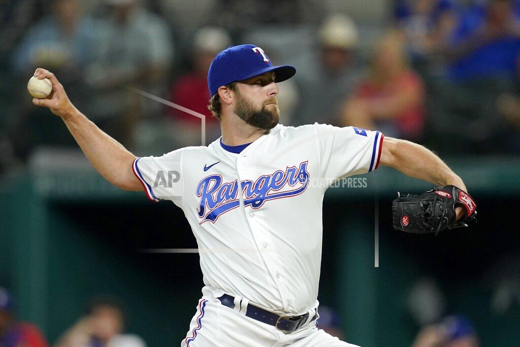 Tony Gutierrez Texas Rangers starting pitcher Jordan Lyles throws during the first inning of the team's baseball game against the Houston Astros in Arlington, Texas, Tuesday, Sept. 14, 2021. (AP Photo/Tony Gutierrez)