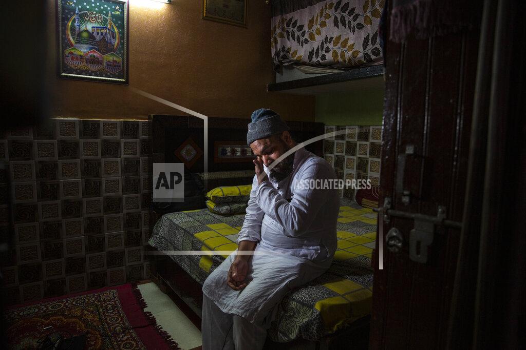 Altaf Qadri Haroon, who saw his 32 year-old brother being shot and killed by his Hindu neighbors during the February 2020 communal riots, breaks down while speaking to Associated Press inside his home in North Ghonda, one of the worst riot affected neighborhood, in New Delhi, India, Friday, Feb. 19, 2021. As the first anniversary of bloody communal riots that convulsed the Indian capital approaches, Muslim victims are still shaken and struggling to make sense of their struggle to seek justice. (AP Photo/Altaf Qadri)