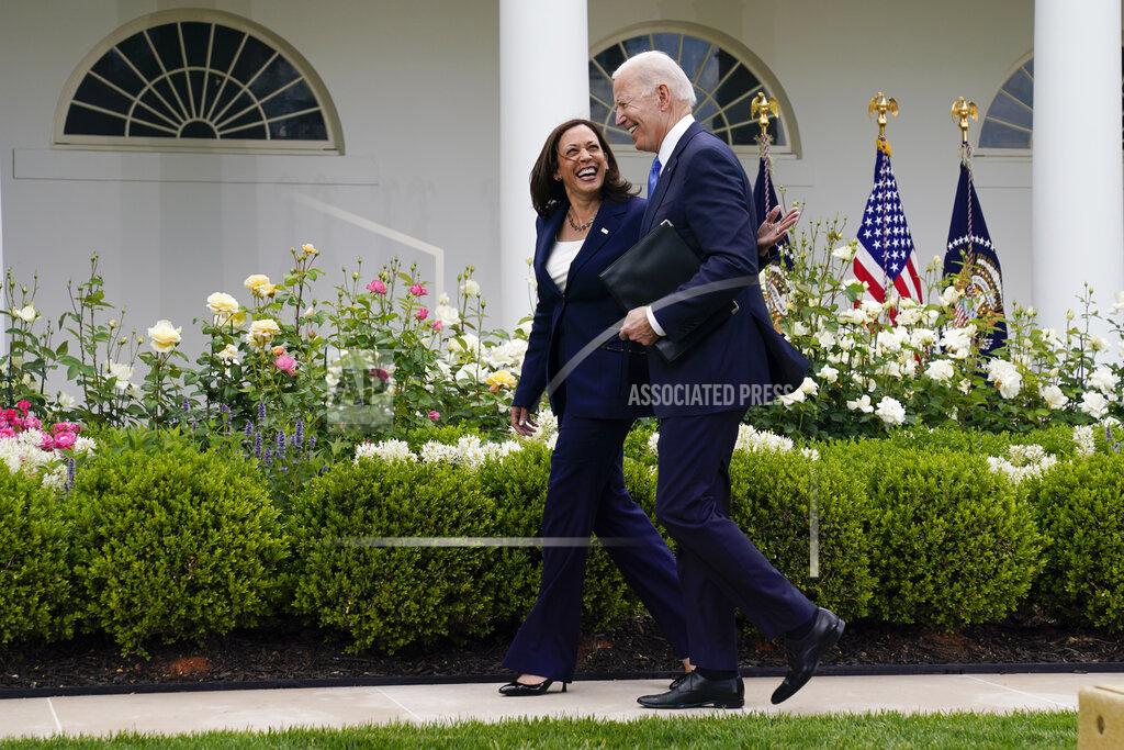 Evan Vucci President Joe Biden walks with Vice President Kamala Harris after speaking on updated guidance on face mask mandates and COVID-19 response, in the Rose Garden of the White House, Thursday, May 13, 2021, in Washington. (AP Photo/Evan Vucci)