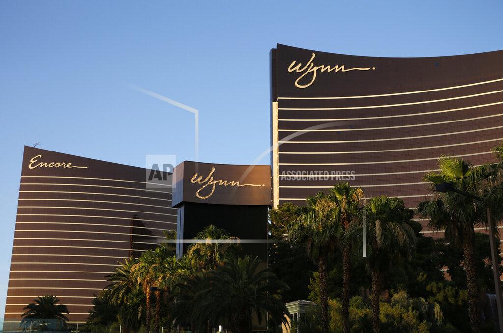 John Locher FILE - This June 17, 2014, file photo shows the Wynn Las Vegas and Encore resorts in Las Vegas, both owned and operated by Wynn Resorts. One Las Vegas Strip casino owner says it tallied 548 positive tests for COVID-19 among its 12,000 employees since May 2020. Wynn Resorts reported Thursday, Sept. 17, 2020, that it had 497 positive tests for the new coronavirus since reopening June 4, 2020, after identifying 51 in initial screenings. (AP Photo/John Locher, File)