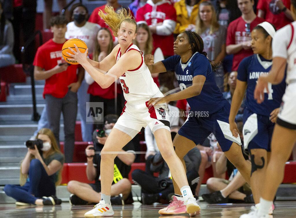 Ben Mckeown North Carolina State's Elissa Cunane (33) backs into Longwood's Brooke Anya (0) during the first half of a college basketball game in the first round of the NCAA tournament in Raleigh, N.C., Saturday, March 19, 2022. (AP Photo/Ben McKeown)