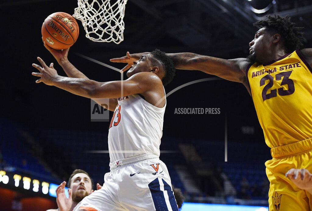 Jessica Hill Virginia's Casey Morsell, left, makes a basket as Arizona State's Romello White defends during the first half of an NCAA college basketball game, Sunday, Nov. 24, 2019, in Uncasville, Conn. (AP Photo/Jessica Hill)