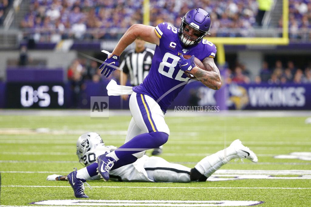Bruce Kluckhohn FILE - In this Sept. 22, 2019, file photo, Minnesota Vikings tight end Kyle Rudolph (82) runs from Oakland Raiders cornerback Daryl Worley (20) after making a reception during the first half of an NFL football game in Minneapolis. The Vikings have released two-time Pro Bowl tight end Rudolph. This ends his 10-season run with the team. The move creates a little more than $5 million in salary cap space. (AP Photo/Bruce Kluckhohn, File)