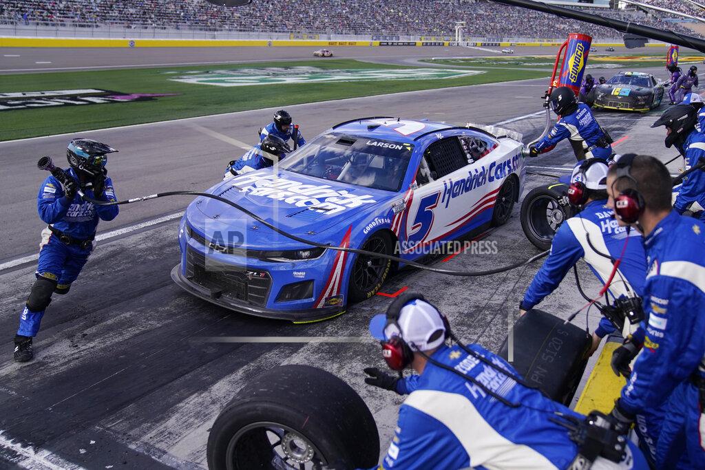 John Locher Kyle Larson (5) makes a pit stop during a NASCAR Cup Series auto race Sunday, March 6, 2022, in Las Vegas. (AP Photo/John Locher)