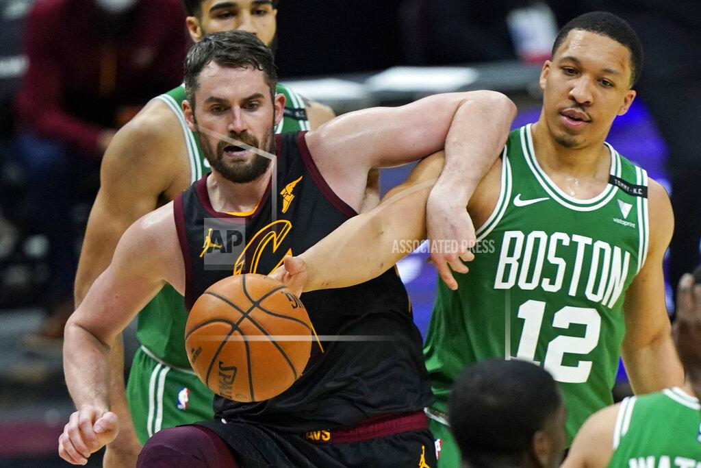 Tony Dejak Cleveland Cavaliers' Kevin Love, left, and Boston Celtics' Grant Williams vie for the ball during the second half of an NBA basketball game Wednesday, May 12, 2021, in Cleveland. The Cavaliers won 102-94. (AP Photo/Tony Dejak)