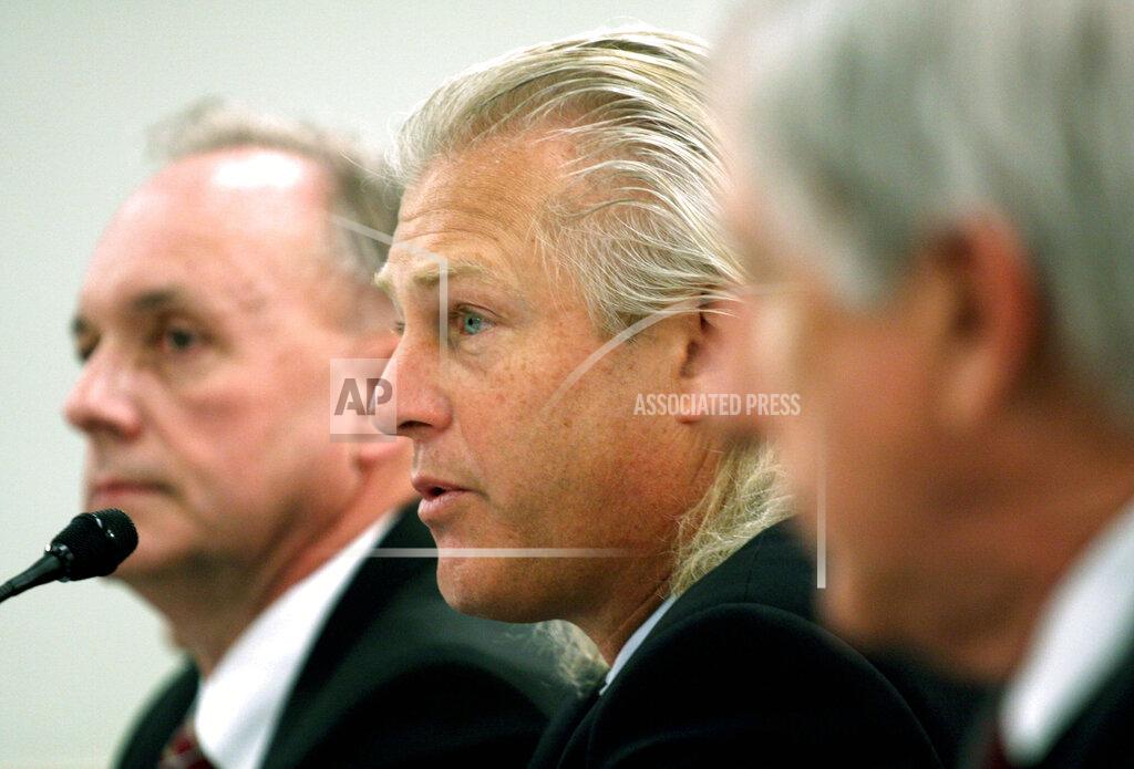 FILE - In this Feb. 26, 2008, file photo, Bumble Bee Foods President and Chief Executive Officer Christopher Lischewski, center, flanked by Butterball President and Chief Executive Officer Keith Shoemaker, left, and Dole Food Company President and Chief Executive Officer David DeLorenzo, testifies on Capitol Hill in Washington. The former CEO of Bumble Bee Foods has been convicted for his part in a canned tuna price-fixing conspiracy involving the industry's top three companies. The Department of Justice says a jury found Lischewski guilty on Tuesday, Dec. 3, 2019. (AP Photo/Lauren Victoria Burke, File)