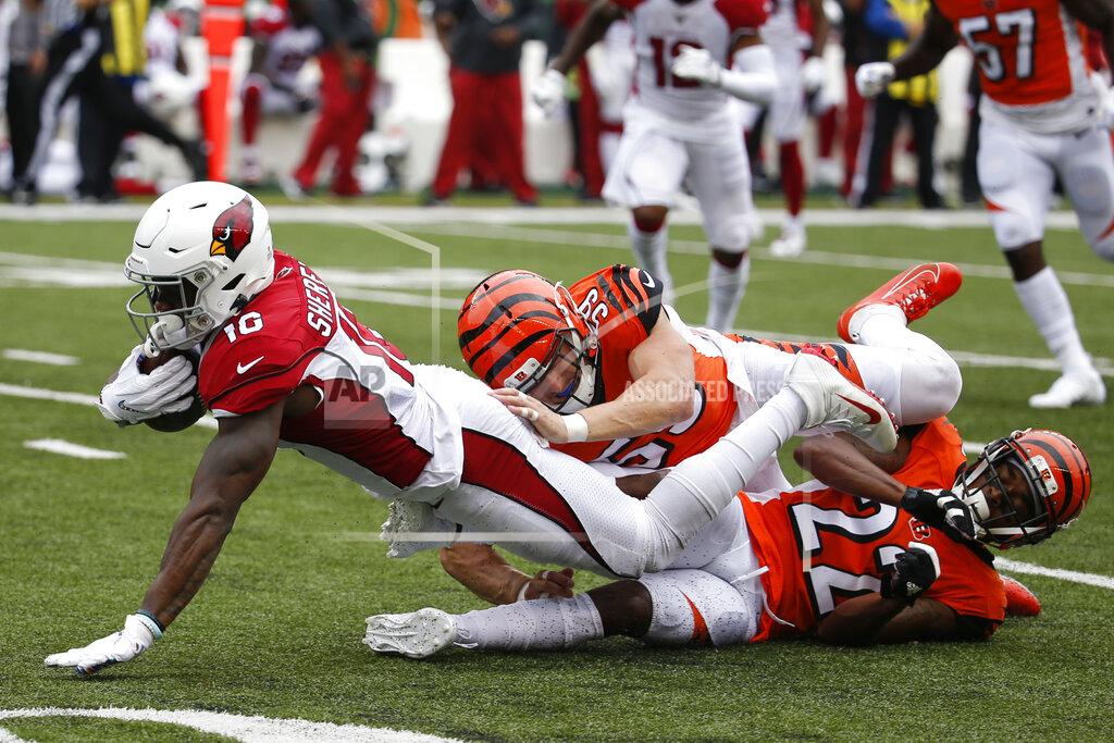 Frank Victores Arizona Cardinals wide receiver Trent Sherfield, left, is tackled by Cincinnati Bengals outside linebacker Nick Vigil (59) and cornerback William Jackson (22) in the first half of an NFL football game, Sunday, Oct. 6, 2019, in Cincinnati. (AP Photo/Frank Victores)