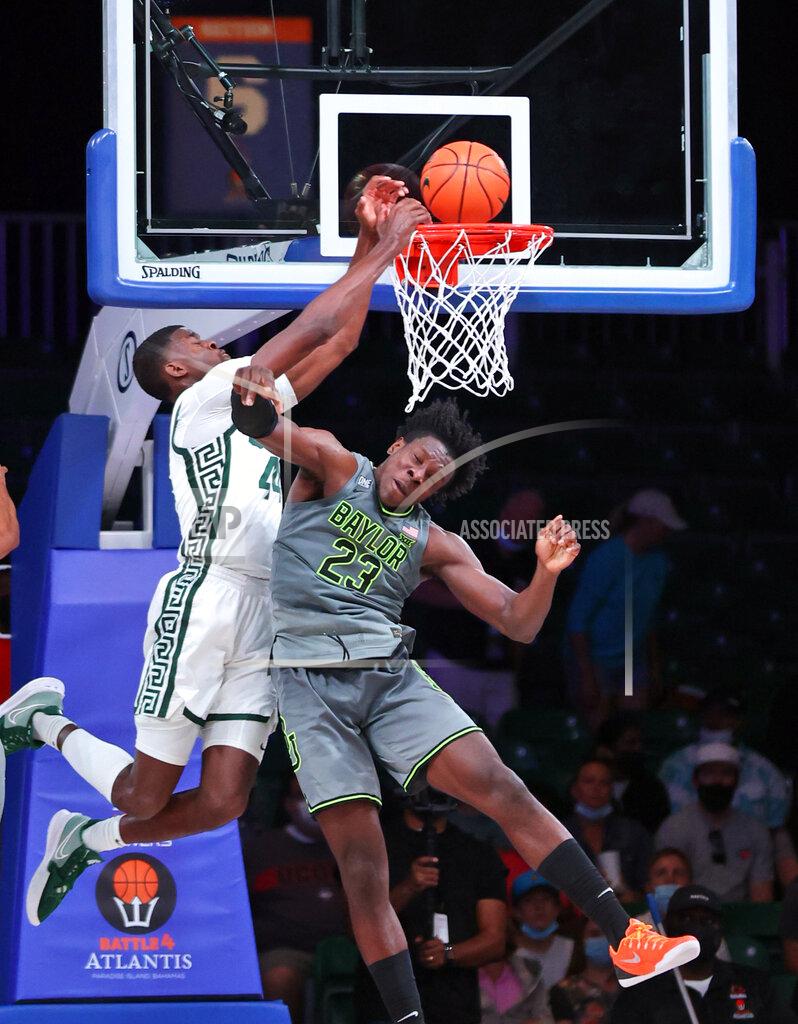 Tim Aylen In this photo provided by Bahamas Visual Services, Michigan State forward Gabe Brown (44) goes to the basket as Baylor forward Jonathan Tchamwa Tchatchoua (23) defends during an NCAA college basketball game at Paradise Island, Bahamas, Friday, Nov. 26, 2021. (Tim Aylen/Bahamas Visual Services via AP)