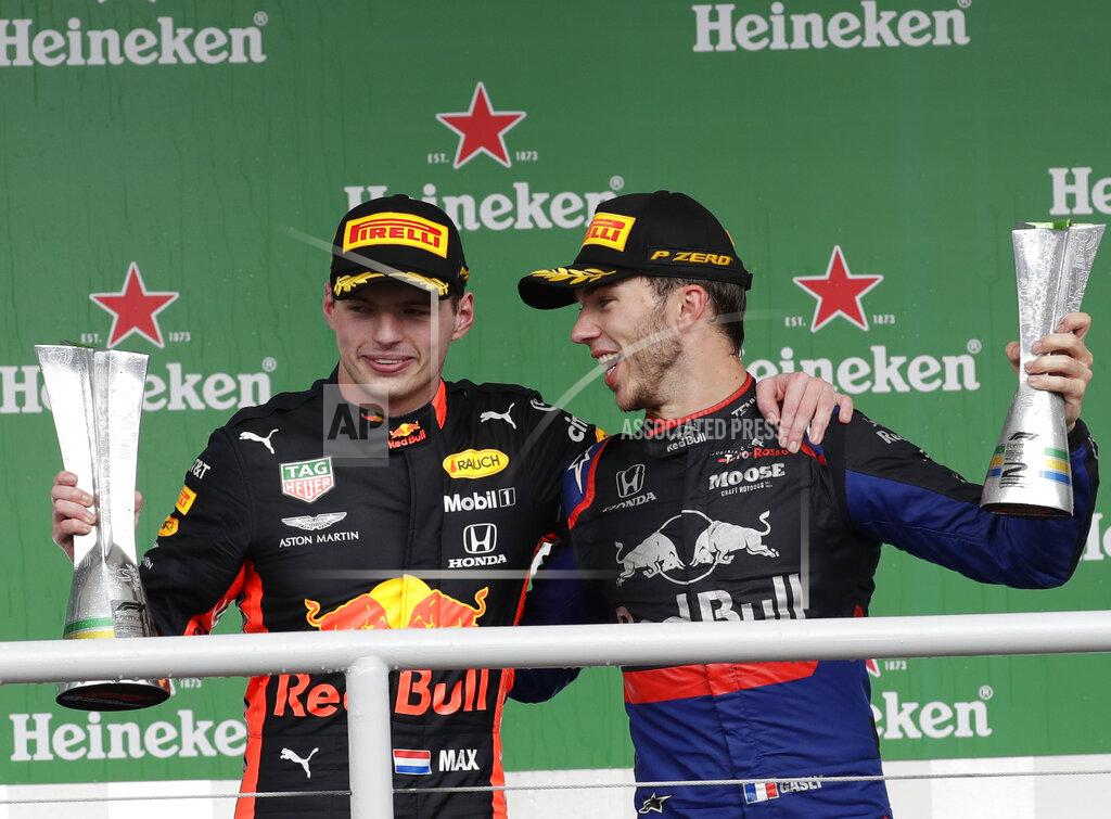 Silvia Izquierdo First place Red Bull driver Max Verstappen, of the Netherlands, left, and Second place finisher Toro Rosso driver Pierre Gasly, of France, celebrate on the podium after the Brazilian Formula One Grand Prix at the Interlagos race track in Sao Paulo, Brazil, Sunday, Nov. 17, 2019. (AP Photo/Silvia Izquierdo)