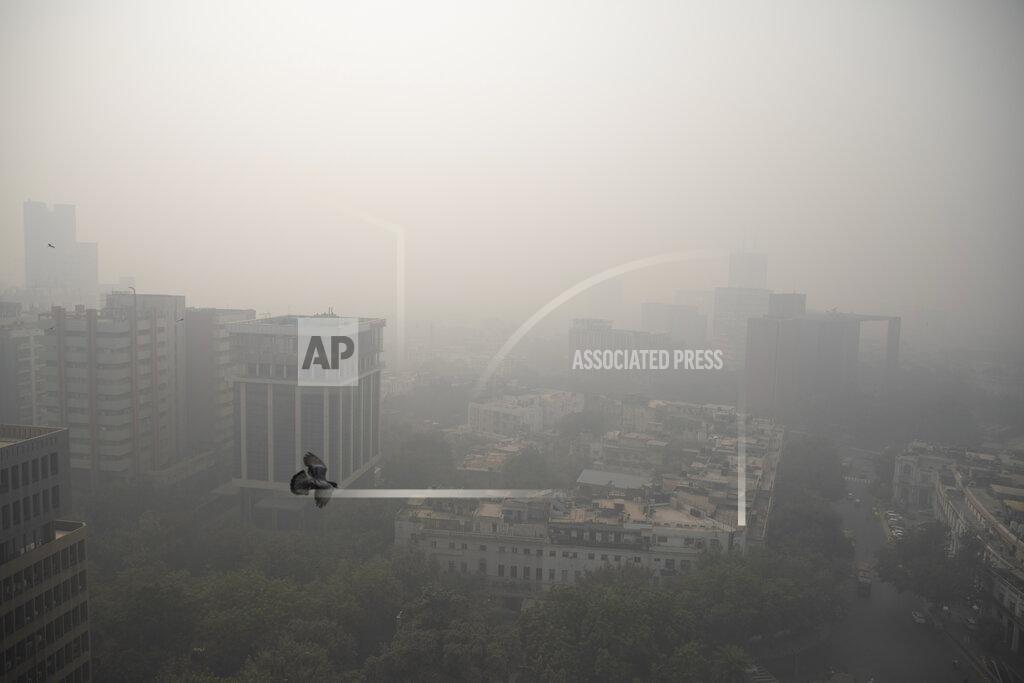 Smog envelopes the skyline in New Delhi, India, Wednesday, Nov. 4, 2020. A thick quilt of smog lingered over the Indian capital and its suburbs on Friday, fed by smoke from raging agricultural fires that health experts worry could worsen the city’s fight against the coronavirus. Air pollution in parts of New Delhi have climbed to levels around nine times what the World Health Organization considers safe, turning grey winter skies into a putrid yellow and shrouding national monuments. (AP Photo/Altaf Qadri)