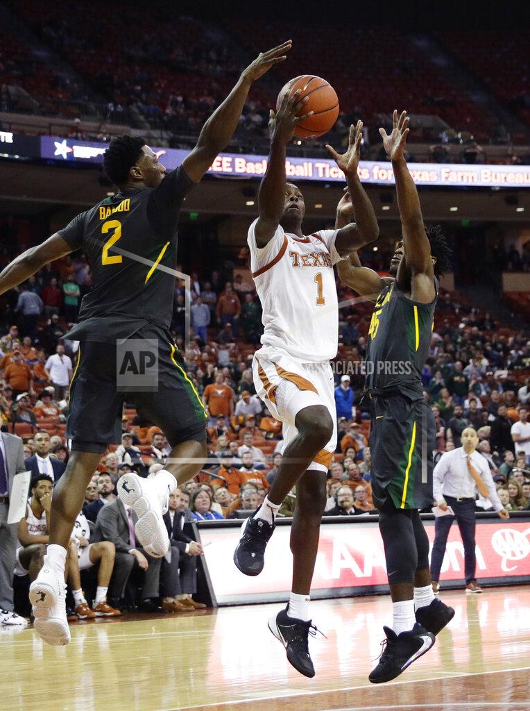Eric Gay Texas guard Andrew Jones (1) is blocked as he tries to score by Baylor guard Devonte Bandoo (2) during the second half of an NCAA college basketball game, Monday, Feb. 10, 2020, in Austin, Texas. (AP Photo/Eric Gay)