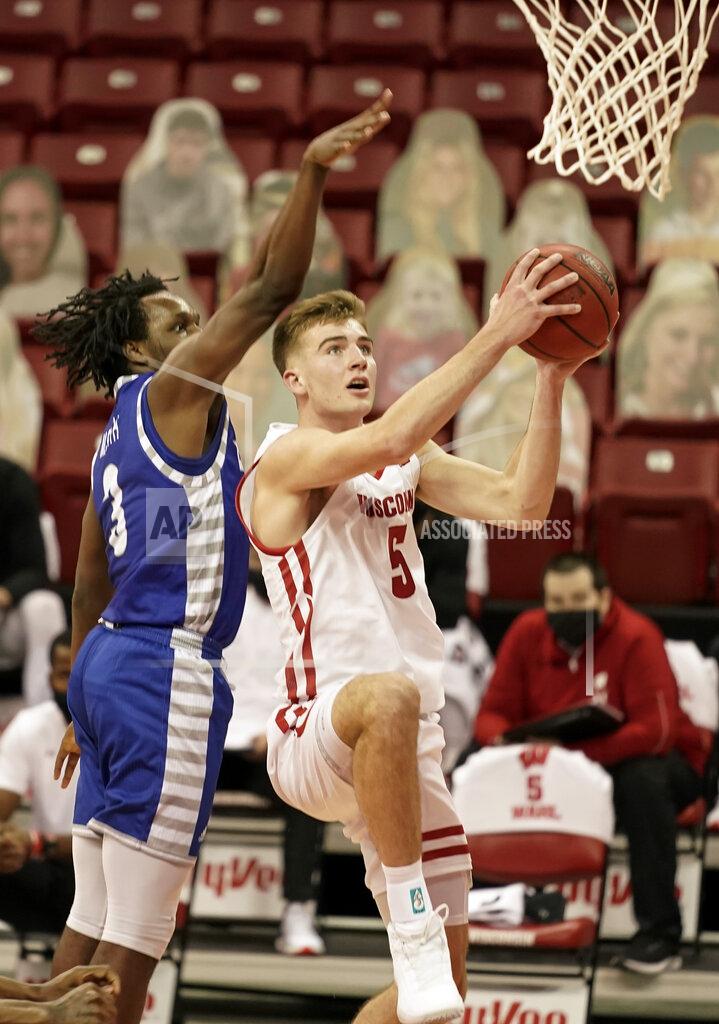 Andy Manis Wisconsin's Tyler Wahl (5) shoots next to Eastern Illinois' Mack Smith (3) during the second half of an NCAA college basketball game Wednesday, Nov. 25, 2020, in Madison, Wis. Wisconsin won 77-67. (AP Photo/Andy Manis)