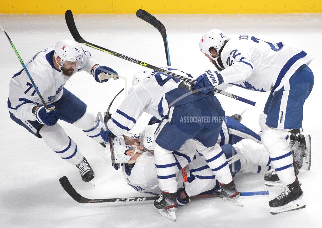 Graham Hughes Toronto Maple Leafs' TJ Brodie (78) celebrates his goal against the Montreal Canadiens with teammates during the third period of Game 6 of an NHL hockey Stanley Cup first-round playoff seres Saturday, May 29, 2021, in Montreal. (Ryan Remiorz/The Canadian Press via AP)