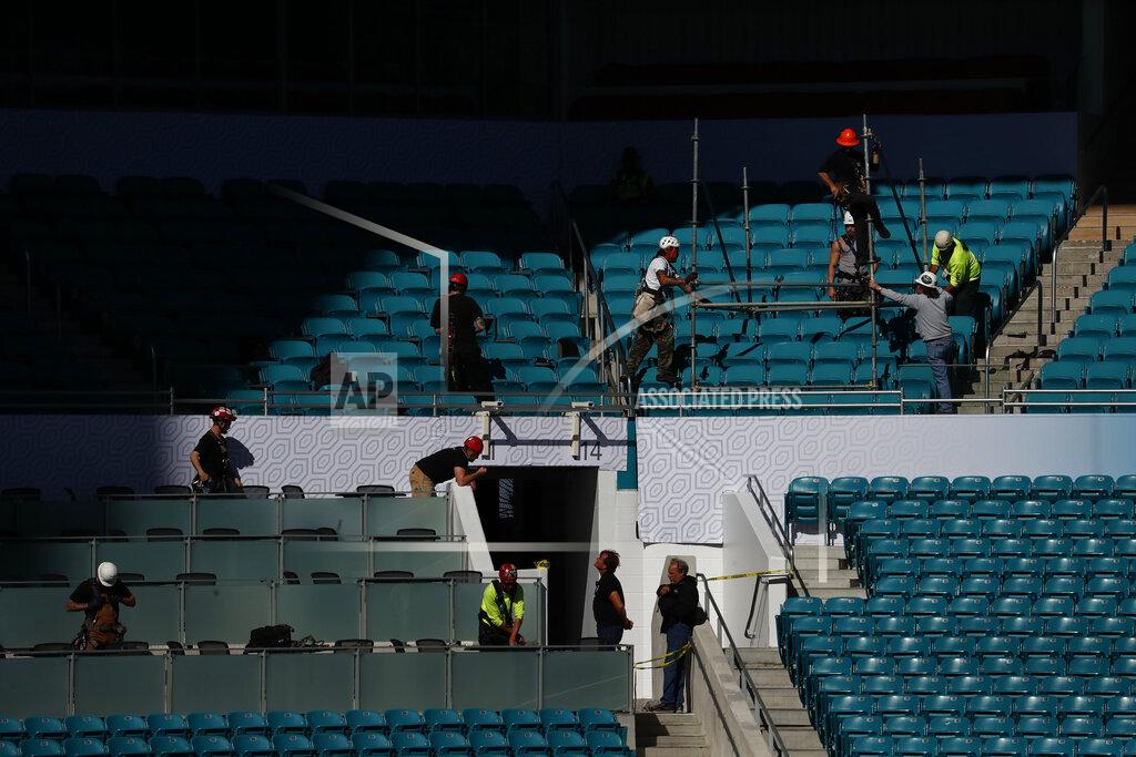 Brynn Anderson Construction workers are seen during a tour of Hard Rock Stadium on Tuesday, Jan. 21, 2020, ahead of the NFL Super Bowl LIV football game in Miami Gardens, Fla. (AP Photo/Brynn Anderson)