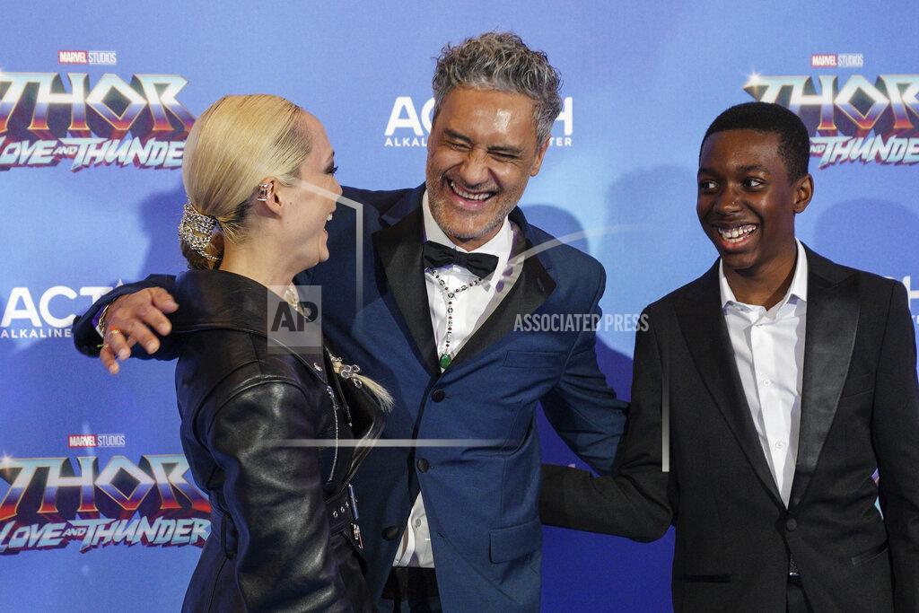 Scott Garfitt Pom Klementieff, from left, director Taika Waititi and Kieron L. Dyer pose for photographers upon arrival at the screening of the film 'Thor: Love and Thunder in London Tuesday, July 5, 2022. (AP Photo/Scott Garfitt)