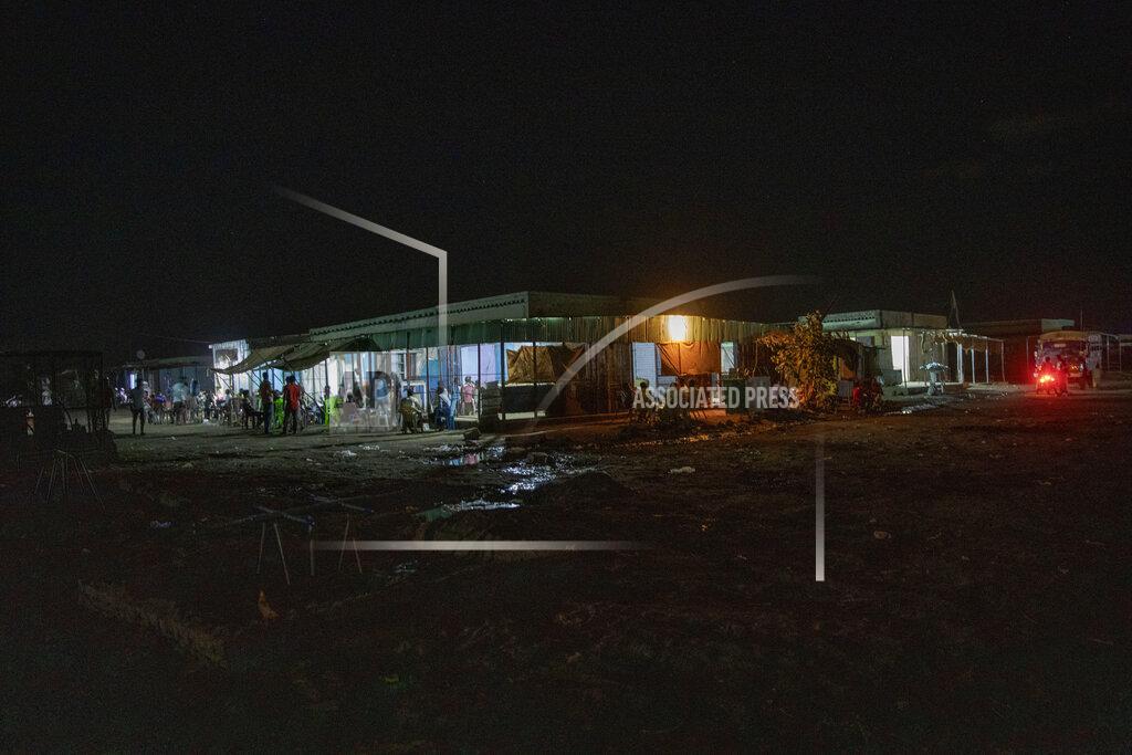 Nariman El-Mofty The main market in front of the clinic run by MSF (Doctors Without Borders), where surgeon and doctor-turned-refugee, Dr. Tewodros Tefera, goes to help staff, in Hamdayet, eastern Sudan, near the border with Ethiopia, on March 22, 2021. (AP Photo/Nariman El-Mofty)