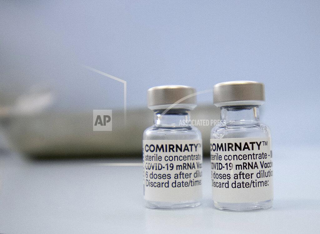 Paul Zinken Vials of Pfizer's Comirnaty vaccine sit on a counter in a family doctor's office in Berlin, Germany, Thursday, April 8, 2021. (Paul Zinken/dpa via AP)