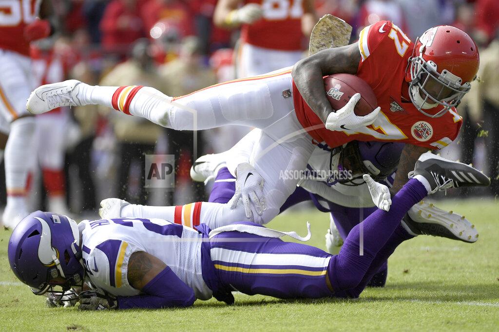 Reed Hoffmann Kansas City Chiefs wide receiver Mecole Hardman (17) is tackled by Minnesota Vikings cornerback Mike Hughes, bottom, during the first half of an NFL football game in Kansas City, Mo., Sunday, Nov. 3, 2019. (AP Photo/Reed Hoffmann)