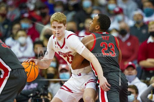 Wisconsin's Steven Crowl (22) drives on Ohio State's Zed Key (23) during the first half of an NCAA college basketball game Thursday, Jan. 13, 2022, in Madison, Wis. (AP Photo/Andy Manis)