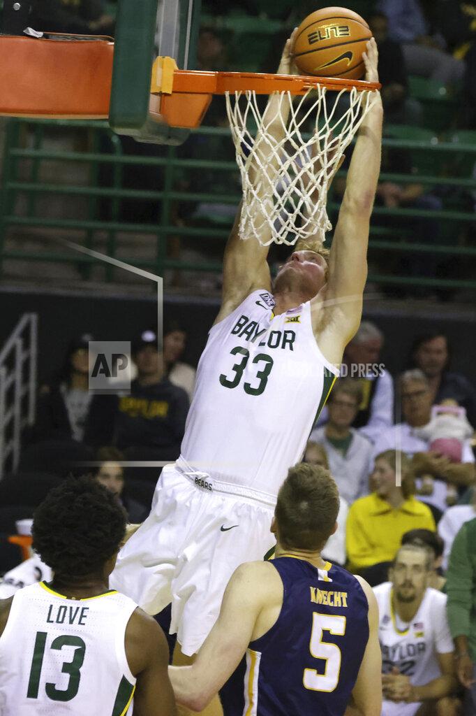 Rod Aydelotte Baylor forward Caleb Lohner (33) drunks over Northern Colorado guard Dalton Knecht (5) in the second half of an NCAA college basketball game, Monday, Nov. 14, 2022, in Waco, Texas. (AP Photo/Rod Aydelotte)