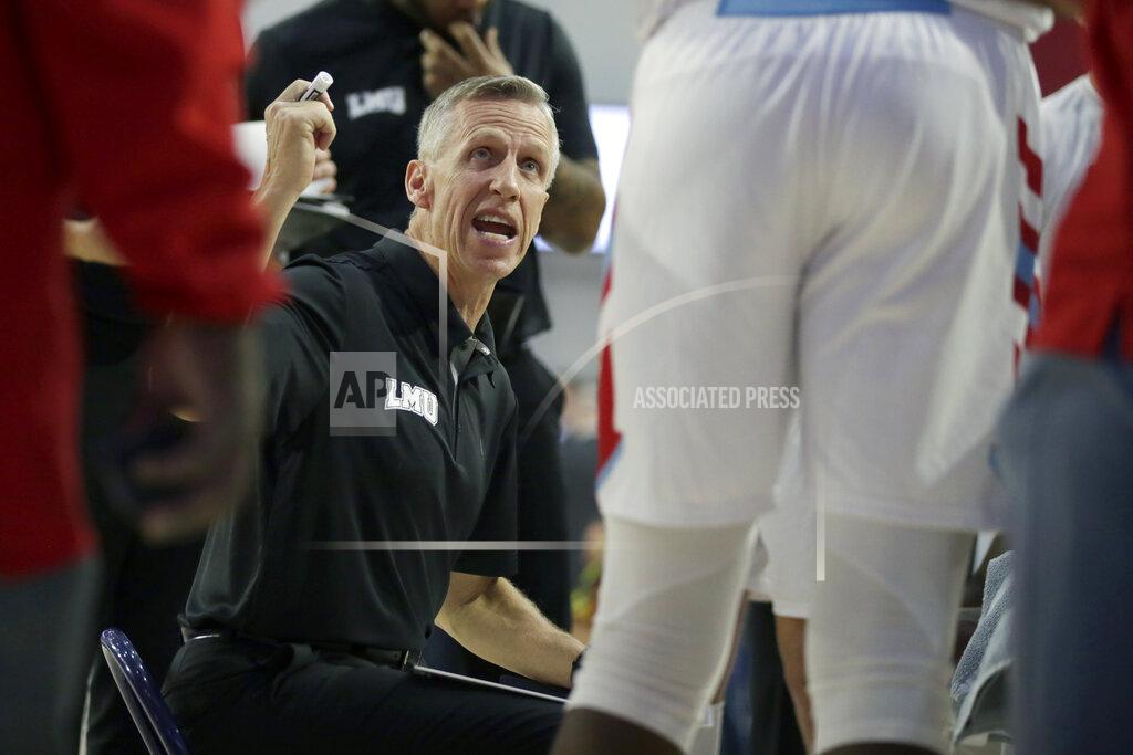 Alex Gallardo Loyola Marymount head coach Mike Dunlap talks to his player during a timout during the first half of an NCAA college basketball game against Gonzaga in Los Angeles, Saturday, Jan. 11, 2020. (AP Photo/Alex Gallardo)