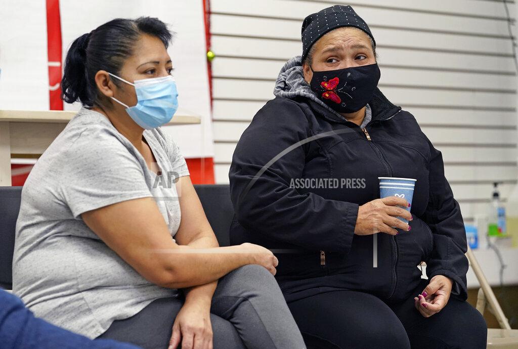 Kathy Willens Graciela Uraga, left, a cleaning lady, and Blanca Cedillos, a nanny, react as they watch Joe Biden's presidential inauguration from the Workers Justice Center, an immigrants rights center, Wednesday, Jan. 20, 2021, in the Sunset Park neighborhood of Brooklyn in New York. Cedillos admitted to being "nervous" when the speech started, but after the speech, said she was disappointed Biden didn't mention immigration reform. (AP Photo/Kathy Willens)