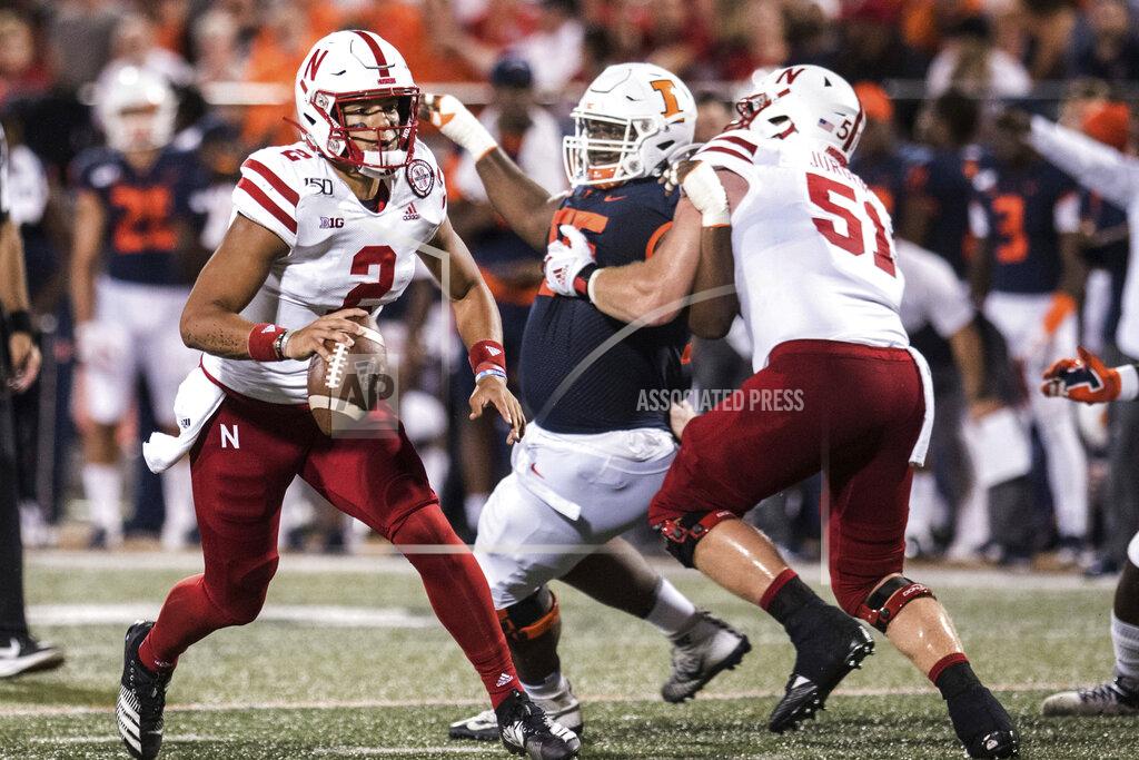 Holly Hart Nebraska's Adrian Martinez (2) is pressured by Illinois' Jamai Milan (55) in the first half of an NCAA college football game, Saturday, Sept. 21, 2019, in Champaign, Ill. (AP Photo/Holly Hart)