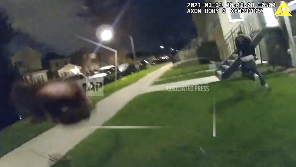 Uncredited In this image taken from Chicago Police body cam video from early Wednesday, March 31, 2021, Anthony Alvarez, right, runs away during a police foot chase in Chicago. Alvarez was fatally shot by police during the incident. Police claim Alvarez, 22, brandished a gun while being chased. (Civilian Office of Police Accountability via AP)