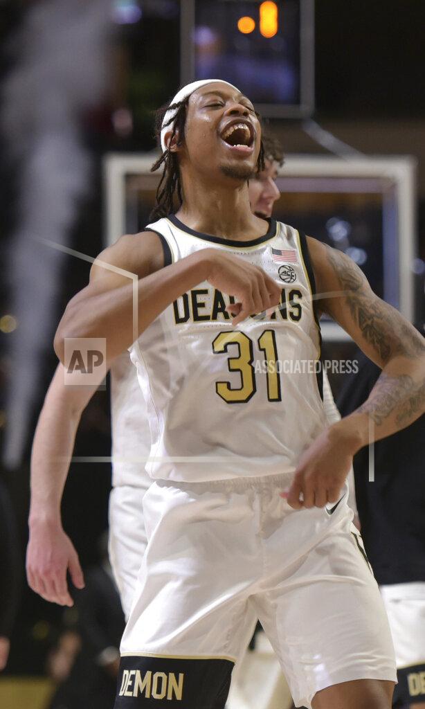 Walt Unks Wake Forest's Alondes Williams celebrats as Syracuse's last second shot fails to fall during the second half of an NCAA college basketball game, Saturday, Jan. 8, 2022 at Joel Coliseum in Winston-Salem, N.C. (Walt Unks/The Winston-Salem Journal via AP)